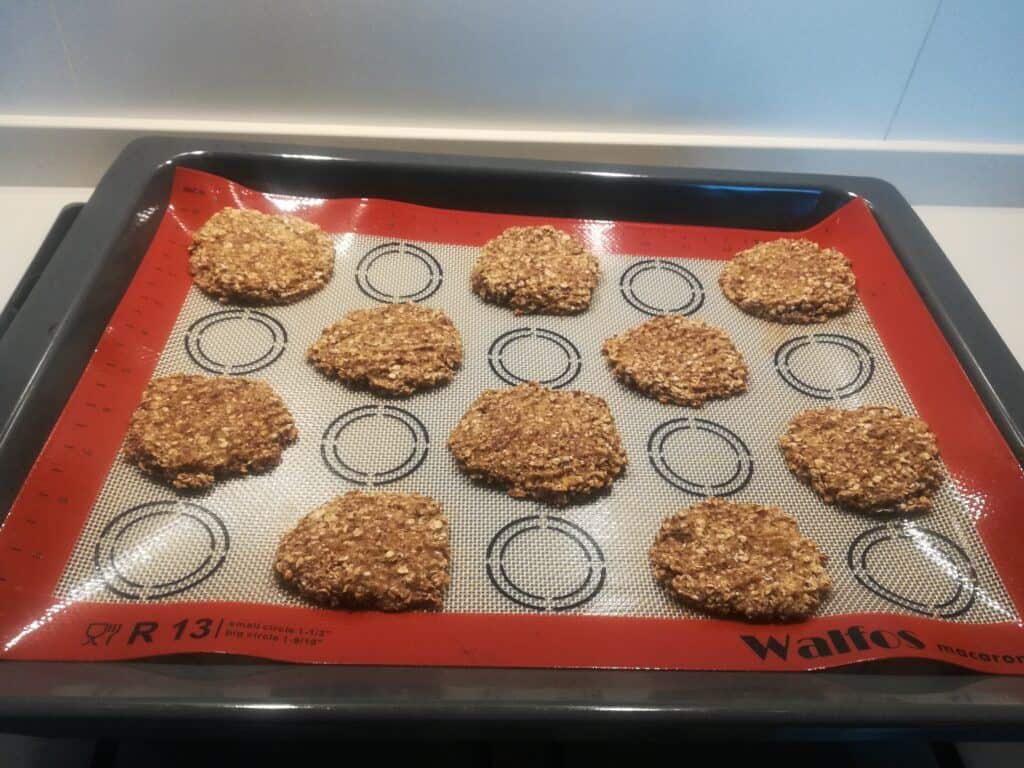 a tray of baked cookies with silicone baking mat.