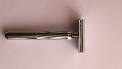 photo of a stainless steel reusable razor to signify the material used as one of the basis in choosing the best reusable razor for women.